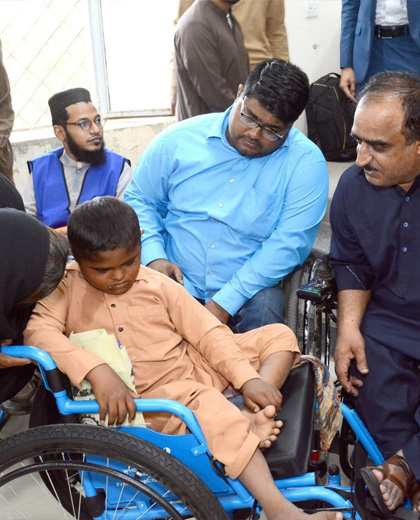 CBID Sindh Seminar at Karachi, in small box panelists of seminar and in bigger image CBID Network member organization Pakistan Independ Living Center members are counselling. In another small box CBID Sindh Members are discussing important matters.
