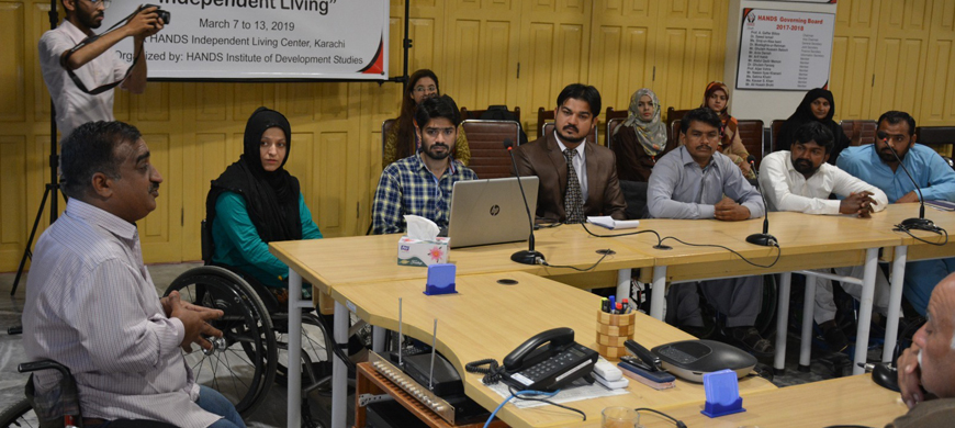 A training session on Independent Living is in progress at Karachi